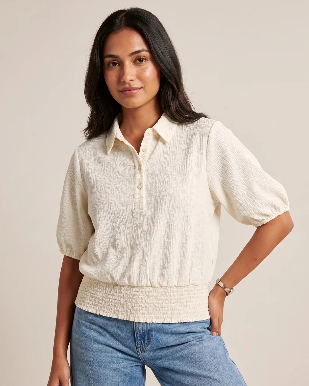 Women’s pastel cream textured top with shirt collar, puff sleeves and smocked waistband by BENKQIN.