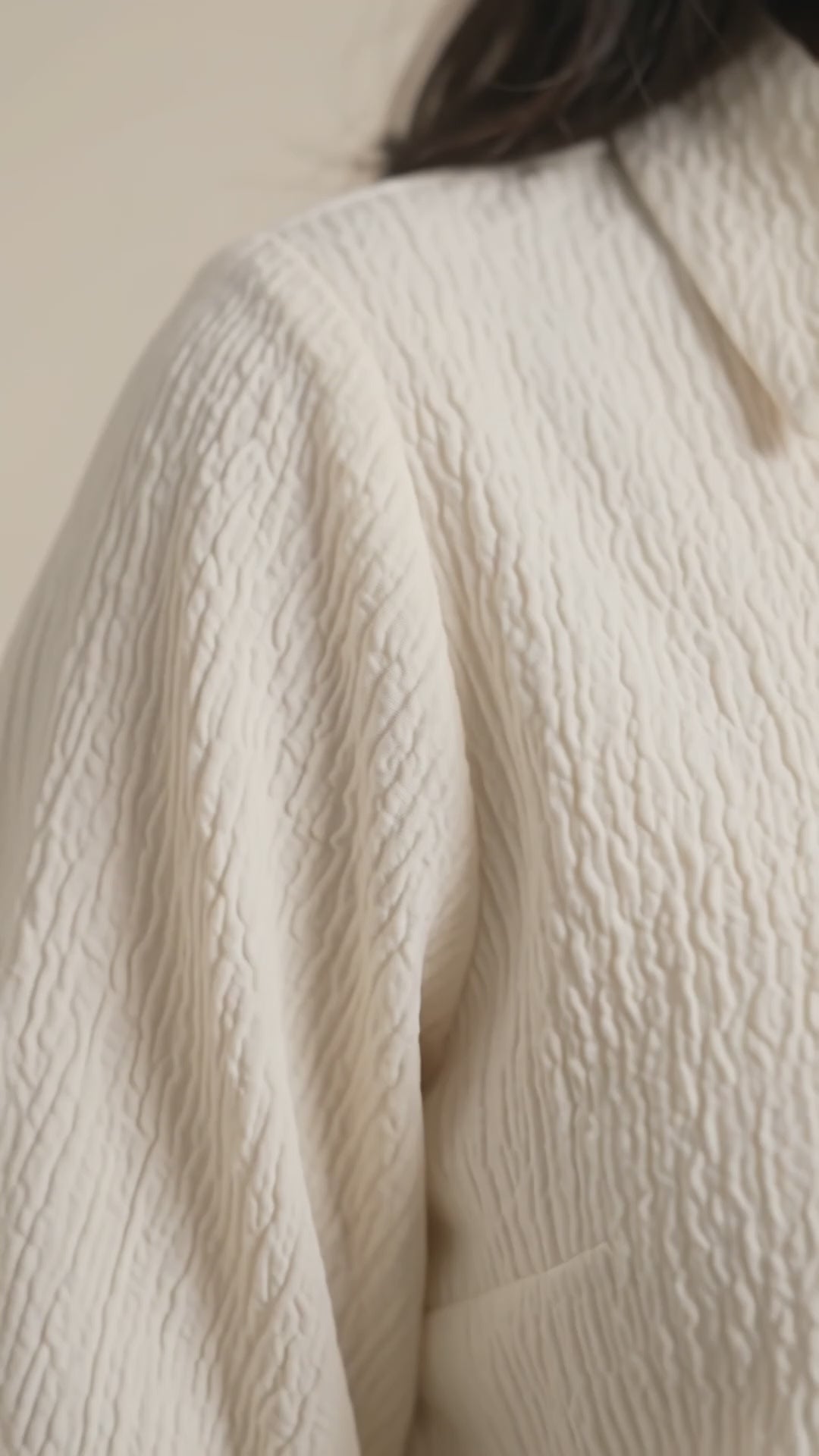 Women’s pastel cream textured top with shirt collar, puff sleeves and smocked waistband by BENKQIN.