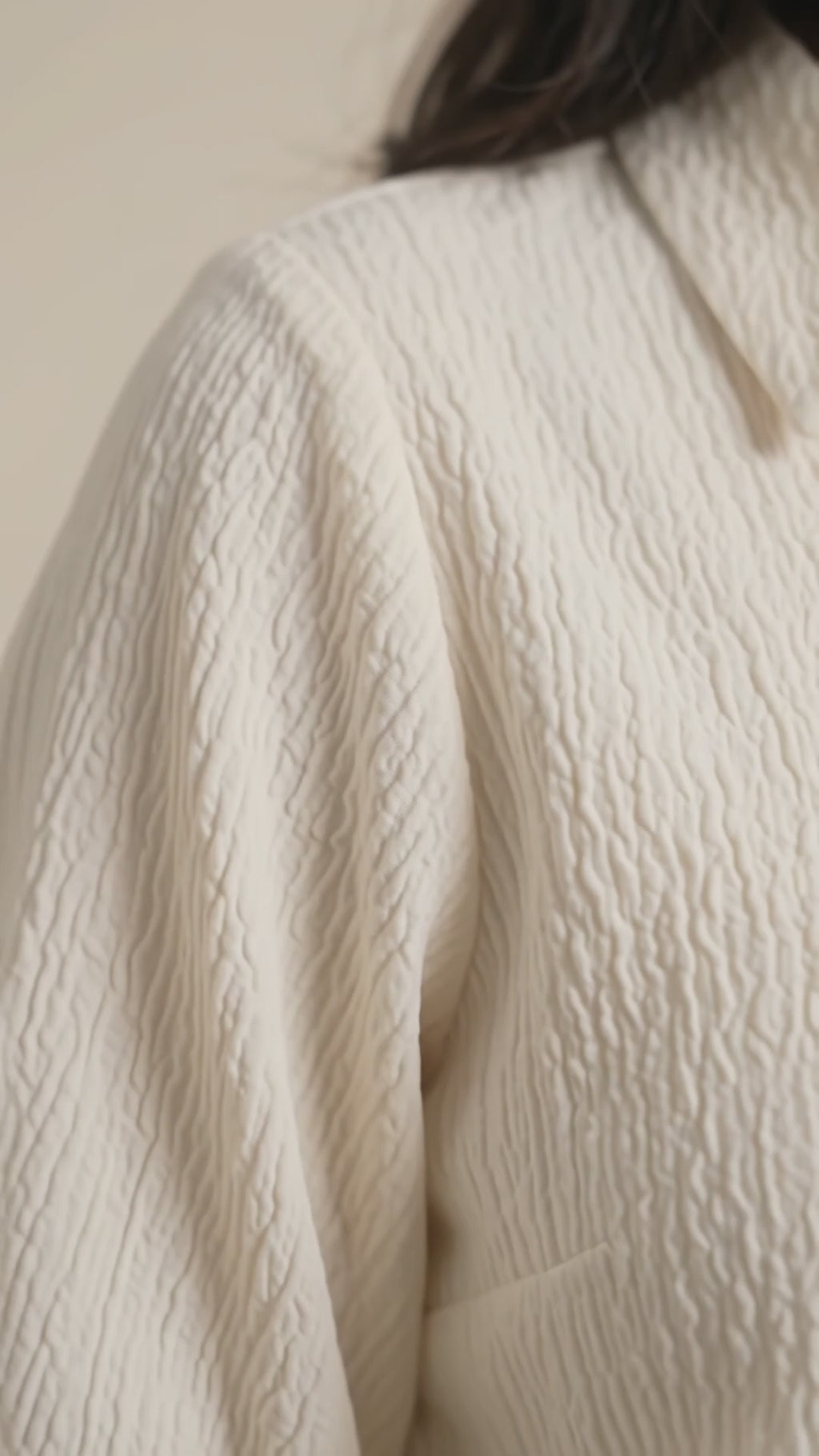 Women’s pastel cream textured top with shirt collar, puff sleeves and smocked waistband by BENKQIN.